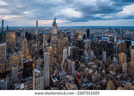 An illuminated midtown of New York City and rainy clouds above. Royalty-Free Stock Photo #2287551029