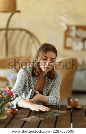 Card game as support for metaphorical representations, systemic Therapy. Psychologist woman having session with metaphorical associative cards.. Royalty-Free Stock Photo #2287559605