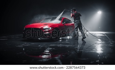 Brand New Sportscar from the Production Line is Being Cleaned with a Water High Pressure Cleaner. Factory Fresh Vehicle in a Detailing Car Wash Before Getting Waxed and Ceramic Coated for Protection Royalty-Free Stock Photo #2287564373