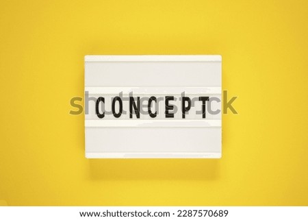 The word concept on lightbox on isolated yellow background