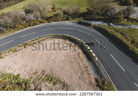Motorbike riding round the famous Gooseneck corner on the Mountain Section of the Isle of Man TT Tourist Trophy which is part of the Snaefell Mounation section 