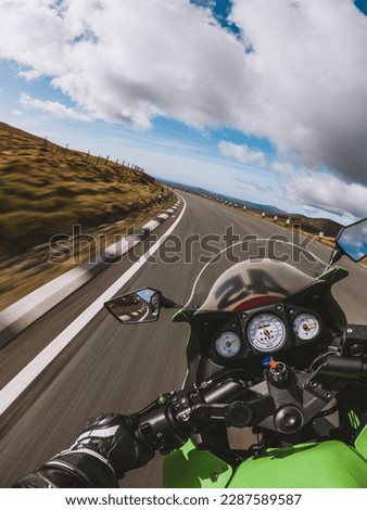 First persion action camera view of a motorbike riding round the famous Snaefell Mountain Section of the Isle of Man TT Tourist Trophy Circuit Royalty-Free Stock Photo #2287589587