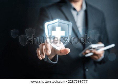 Health insurance concept. Businessman using smartphone using online service healthcare medical protection icon, health and access to welfare health concept.