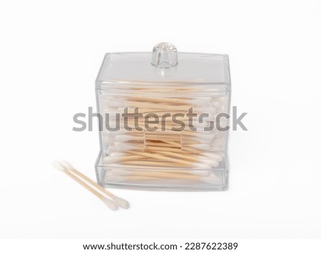 Cotton swabs in holder isolated on white background. Bamboo cotton buds. Means for hygiene of ears. Eco friendly materials.