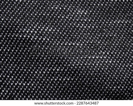 Texture of black fabric . Close-up