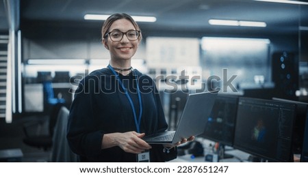 Portrait of an Attractive Empowered Multiethnic Woman Looking at Camera and Charmingly Smiling. Businesswoman at Work, Information Technology Manager, Software Engineering Professional Royalty-Free Stock Photo #2287651247