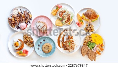 Fancy Breakfast table top angle with variety of dishes.  Royalty-Free Stock Photo #2287679847
