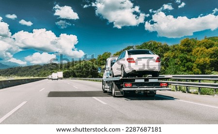 Tow Truck Transporting Car Or Help On Road Transports Wrecker Broken Car. Car Service Transportation Concept. Auto Towing, Tow Truck For Transportation Faults And Emergency Cars . Tow Truck Moving In Royalty-Free Stock Photo #2287687181