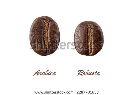 Dark roasted Arabica and Robusta coffee beans closeup isolated on white background. Royalty-Free Stock Photo #2287701833