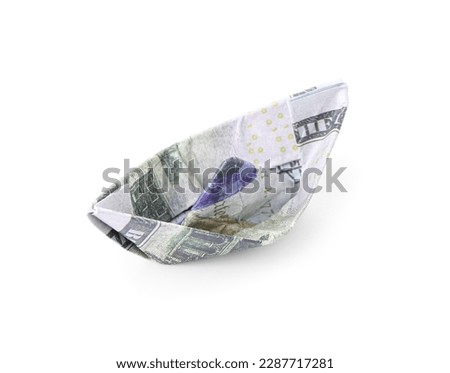 Origami boat made of dollar banknotes on white background