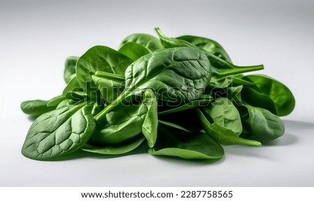 a pile of spinach against a white background Royalty-Free Stock Photo #2287758565