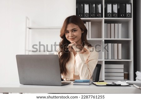 Portrait of successful confident pretty, Young asian business woman or freelancer wearing formal stylish clothes, arms crossed, looking at camera, smiling friendly
