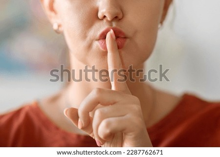 Keep Silence. Unrecognizable Asian Woman Showing Shh Gesture At Camera, Mysterious Female Holding Finger Near Lips, Gesturing Hush While Standing Indoors At Home, Closeup Shot, Cropped Royalty-Free Stock Photo #2287762671