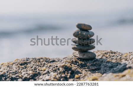 Rock Stone Stack on sea beach Background, sign Zen meditation