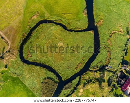 Meandering Biebrza river - amazonian style - National Park in Poland - beautiful nature landscape, green fields and blue sky Royalty-Free Stock Photo #2287775747
