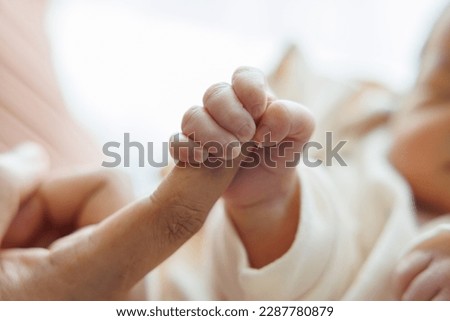 new born baby hand hold mum index finger. concept : Premature or preterm baby in hospital. relationship between mother and baby. Royalty-Free Stock Photo #2287780879