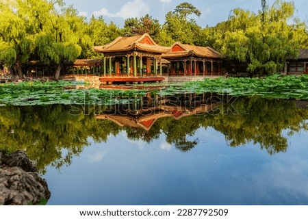 This picture was taken in the Harmony Garden of the Summer Palace，Hanyuan Hall reflected in the lotus pond，blue sky and white clouds，The tranquility of the lake looks like a mirror，nice viewso beautif