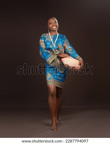 Young african lady wearing african print design Royalty-Free Stock Photo #2287794097