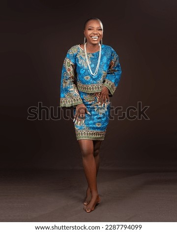 Young african lady wearing african print design Royalty-Free Stock Photo #2287794099