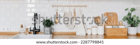 Large banner View of white modern country style kitchen interior with hanging storage, eco friendly food storage. Zero waste home concept
