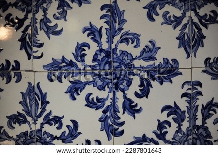 Portuguese azulejo ceramic tiles, closeup photo of decorative, vintage, historic azulejos on the wall