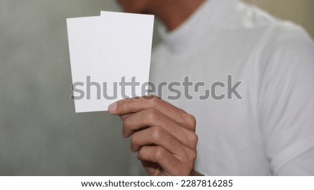 photo of blank white card in hand