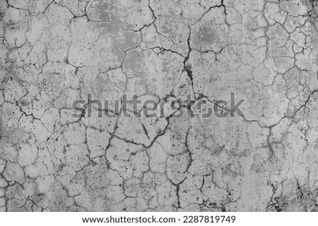 Grey cracked concrete wall texture. Abstract background of crack concrete wall. Royalty-Free Stock Photo #2287819749