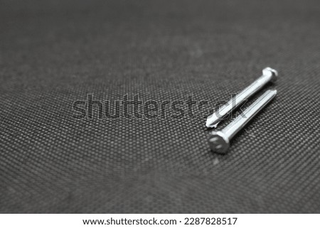 Concrete nail, a nail made of strong metal and one of the construction materials.