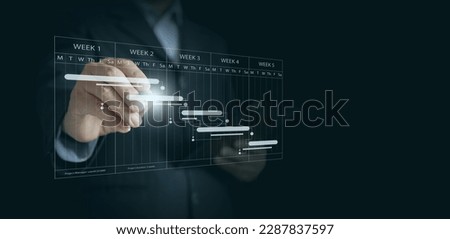 Project Manager Planning and Scheduling: Writing on a Project Timeline to Ensure Timely Completion. Project Management Concept Royalty-Free Stock Photo #2287837597