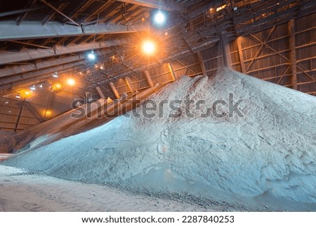 Copper concentrate being stored in a warehouse Royalty-Free Stock Photo #2287840253