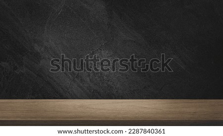 empty wooden oak tabletop with dark black cement stone background for product displayed in rustic mood and tone. luxury background for product stand with empty copy space for party, promotion.