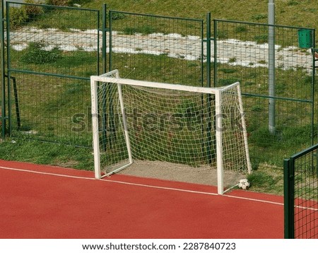 Parts of the soccer goal. Two posts, sidebar and net. Football. Mini, red field . Popular game. Stip, 2023. Macedonia. Royalty-Free Stock Photo #2287840723