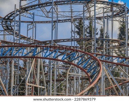 Abandoned rollercoaster in a park in middle of the city. Amusement park built during Soviet Union times in Elektrenai, Lithuania Royalty-Free Stock Photo #2287869379