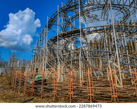 Abandoned rollercoaster in a park in middle of the city. Amusement park built during Soviet Union times in Elektrenai, Lithuania Royalty-Free Stock Photo #2287869473