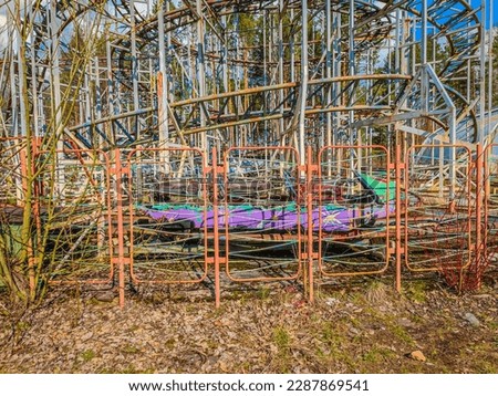 Abandoned rollercoaster in a park in middle of the city. Amusement park built during Soviet Union times in Elektrenai, Lithuania Royalty-Free Stock Photo #2287869541