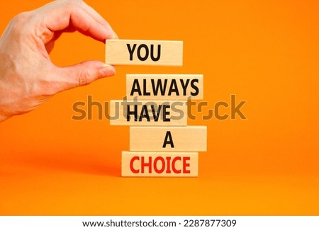 You always have choice symbol. Concept words You always have a choice on wooden block. Beautiful orange table orange background. Businessman hand. Business you always have choice concept. Copy space.