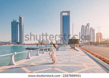 Strolling along the Abu Dhabi Corniche, a scenic waterfront promenade with stunning views of the Arabian Gulf and the city's iconic skyscrapers, is a must-do for any visitor to the UAE's capital. Royalty-Free Stock Photo #2287888961
