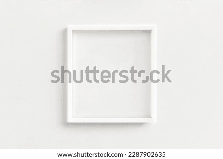 white frame mockup on white wall. Minimalism