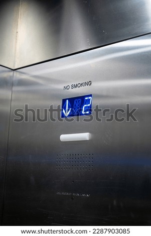 Descending Elevator in modern budling