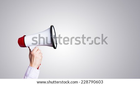 hand with megaphone Royalty-Free Stock Photo #228790603