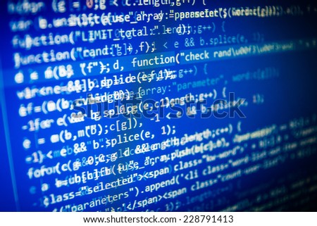 Programming code abstract screen of software developer. Blue computer script. Shallow depth of field and vignette shadow effect.