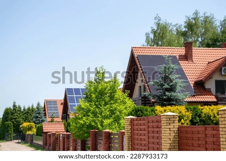 Historic farm house with modern solar panels on roof and wall High quality photo Royalty-Free Stock Photo #2287933173