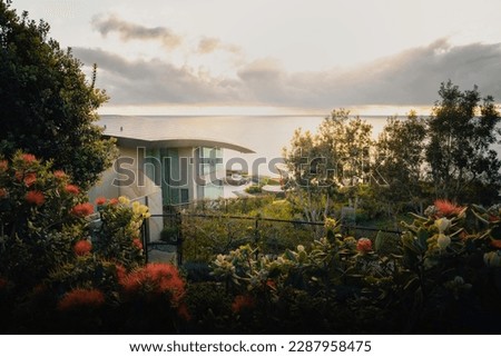 Beautiful sunset of La Jolla Beach, San Diego. Landscape photography. Sunny dawn. Colorful summer panorama landscape. Fantastic house with colorful trees and flowers. Warm sunset.