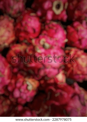 defocused of pile dragon fruit in the market. From the top view.