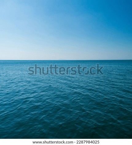 Vertical front view landscape Blue sea and sky blue background morning day look calm summer Nature tropical sea Beautiful  ocen water travel "Bangsaen Beach" East thailand Chonburi Exotic horizon. Royalty-Free Stock Photo #2287984025