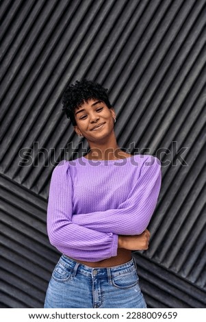 Stock photo of cool african girl smiling and looking at camera. Royalty-Free Stock Photo #2288009659
