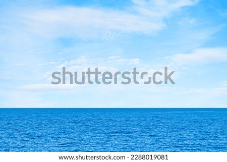 Blue sea and white clouds on sky. Water cloud horizon background. Feeling calm, cool, relaxing. The idea for cold background and copy space on the top. the ocean deep indigo Royalty-Free Stock Photo #2288019081