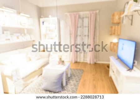 Blurred background cozy living room white background with copy space. Warm home interior bright simple living space. Home showcase interior light bokeh furniture decor. Home Blurry background concept