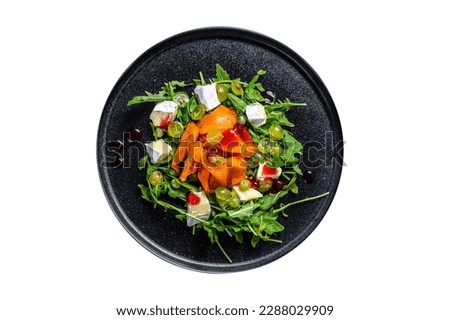 Autumn salad with baked pumpkin and brie cheese. Healthy vegan food concept. Isolated on white background