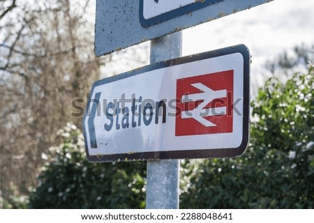 Nantwich Train station sign with arrow and national railway logo, transportation, travel and informational display concept illustration.